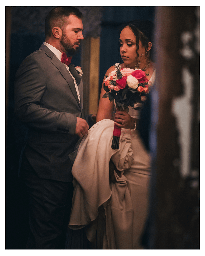 A nervous bride being steadied by a calm masculine presence moments before the ceremony