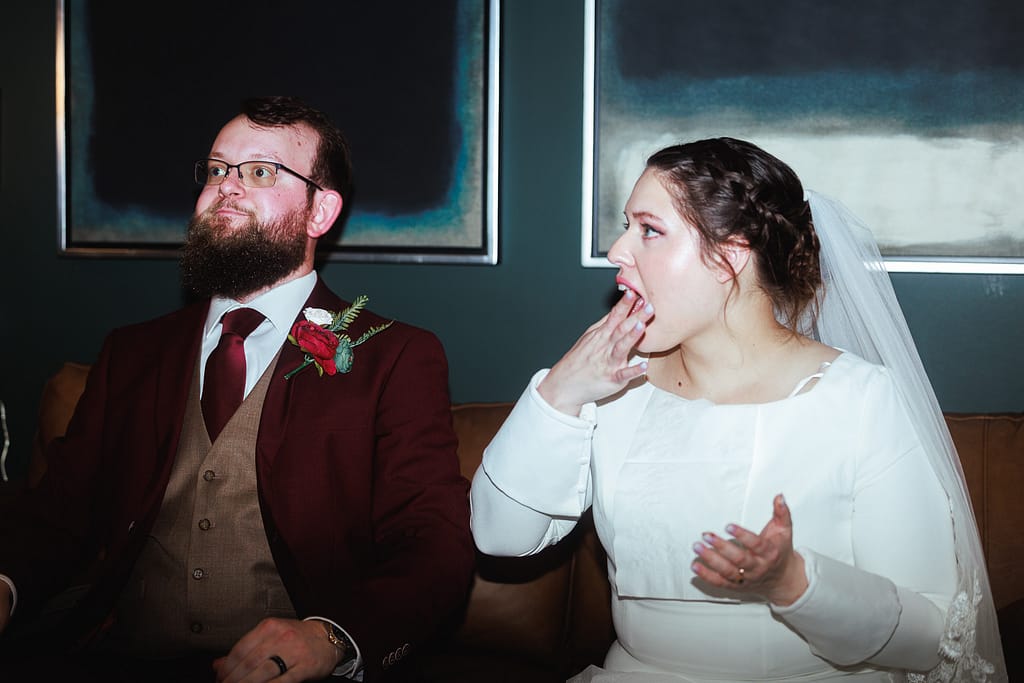 Bride and Groom Celebrating their union eating chicken wings. Lake Charles Wedding